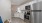 Spacious and well lit kitchen with wood flooring and stainless steel appliances